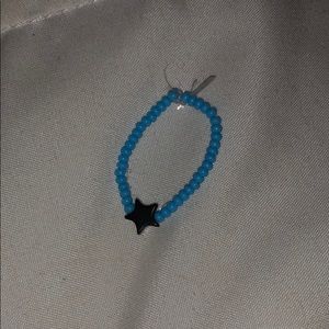 A blue and gray star ring